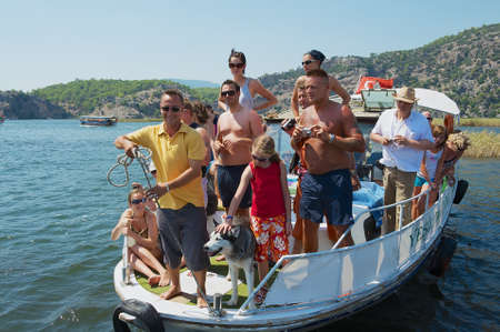 Mugla, Turkey, August 13, 2009 - Tourists take part in river cruise by the Dalyan river in Mugla, Turkey.のeditorial素材