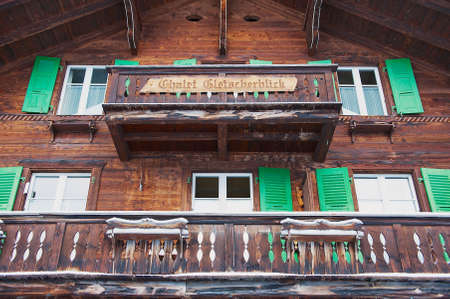 Murren, Switzerland - December 08, 2009: Exterior of the traditional wooden chalet in Murren, Switzerland. Murren is a famous car-free ski resort in Switzerland.のeditorial素材