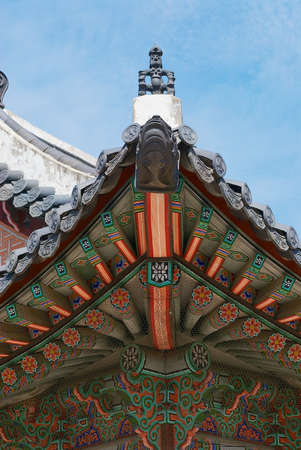 Roof of the Gyeongbokgung palace building with a blue sky in Seoul, Korea.