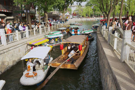 Beijing China, May 01, 2013 - People enjoy the boat trip at the Houhai lake channel in Beijing, China.のeditorial素材