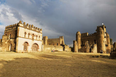 Gondar, Ethiopia, January 22, 2010 - Tourists explore medieval fortress in Gondar, Ethiopia. Gondar...