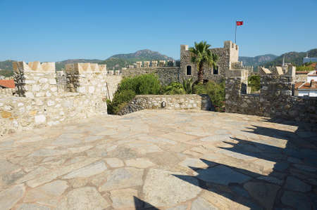Marmaris, Turkey - August 12, 2009: View to the walls and tower of the Marmaris castle in Marmaris, Turkey.のeditorial素材