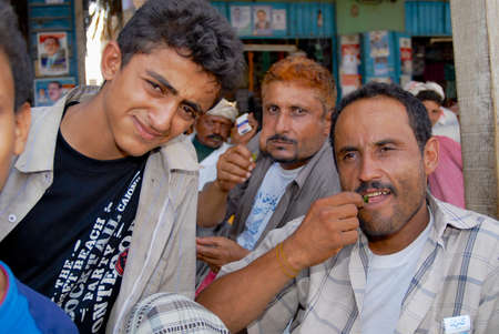 Lahij, Yemen, September 15, 2006 - Men sell and chew khat (Catha edulis) at the local market in Lahij, Yemen. Chewing khat (drug of abuse) is a major social problem in Yemen.のeditorial素材
