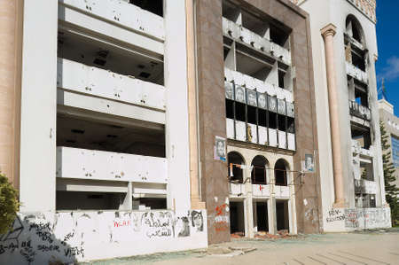 Sfax, Tunisia - November 30, 2011: Exterior of the Democratic Constitutional Rally party building ruined during the Arab spring in Sfax, Tunisia.のeditorial素材