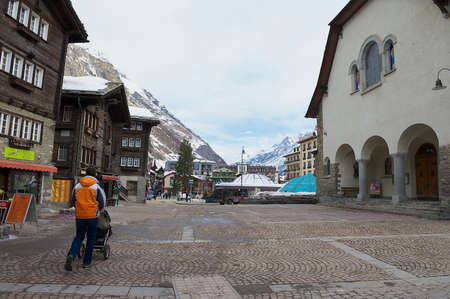 Zermatt, Switzerland - March 04, 2009: View to the square and traditional wooden buildings in Zermatt, Switzerland. Zermatt is one of the most popular ski resorts in Switzerland.のeditorial素材