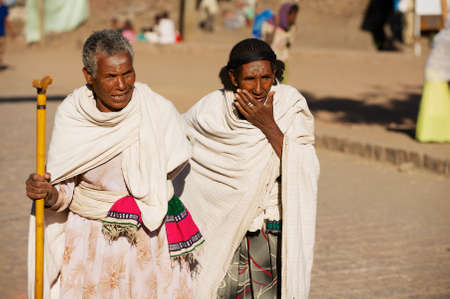 Lalibela, Ethiopia, January 27, 2010 - Pilgrims walk by the street in Lalibela, Ethiopia.のeditorial素材