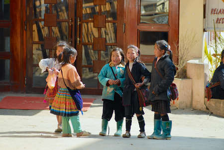Sapa, Vietnam, February 10, 2007 - Children of the Black Miao (Hmong) minority hill tribe wearing...