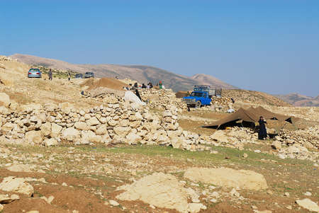 Circa Isfahan, Iran - June 22, 2007: View to the Bakhtiari nomadic people camp circa Isfahan, Iran. Some Bakhtiaris in Iran still follow nomadic lifestyle, live in tents and wear traditional dress daily.のeditorial素材