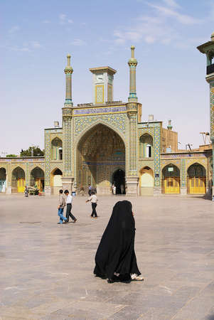 Qom, Iran, June 26, 2007 - People walk in front of the Fatima Masumeh Shrine in Qom, Iran. Qom is considered by Shia Muslims one of the most sacred cities in Iran.のeditorial素材