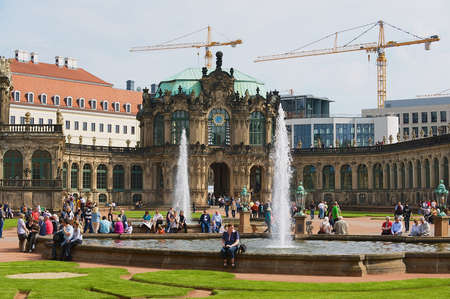 Dresden, Germany, May 22, 2010 - People relax next to the fountain in famous Zwinger palace in Dresden, Germany.のeditorial素材