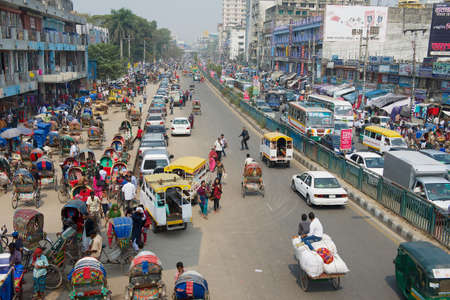 Dhaka, Bangladesh - February 22, 2014: Busy traffic at the central part of the city in Dhaka, Bangladesh. Dhaka is one of the most overpopulated cities in the world.のeditorial素材