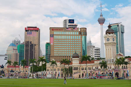 Kuala Lumpur, Malaysia - August 29, 2009: View to the Sultan Abdul Samad building with modern buildings at the background of the Independence Square (Dataran Merdeka) in Kuala Lumpur, Malaysia.のeditorial素材