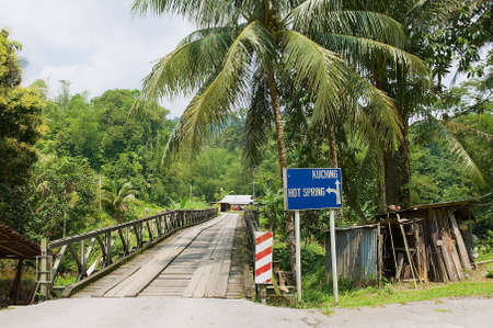 Kuching, Malaysia - August 27, 2009: View to the bridge leading to the Annah Rais Bidayuh village in...