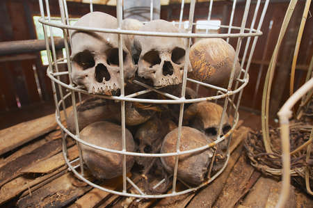 Kuching, Malaysia - August 27, 2009: Human sculls in the cage in the Headhouse of Annah Rais Bidayuh longhouse - the main building of the headhunters village in Kuching, Malaysia.のeditorial素材