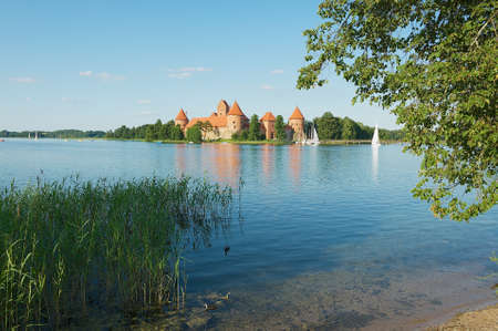 Trakai, Lithuania - July 17, 2009: View to the Trakai castle and Galve lake with boats in Trakai, Lithuania.のeditorial素材