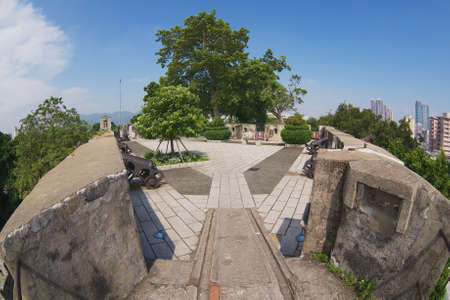 Macau, China - September 11, 2013: View on the old Portuguese cannons located on the walls of the Guia Fortress in Macau, China.のeditorial素材