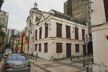 Macau, China - September 12, 2013: View to the old buildings and street at the historic quarter in Macau, China.のeditorial素材