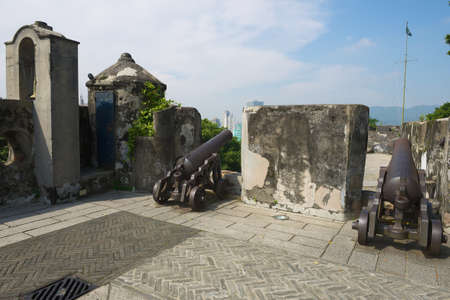 Macau, China - September 11, 2013: Old Portuguese cannons located on the exterior wall of the Guia Fortress in Macau, China.のeditorial素材