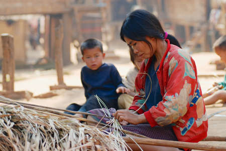 Luang Prabang, Laos, February 13, 2007 - Woman in the poor village near Luang Prabang, Laos.のeditorial素材