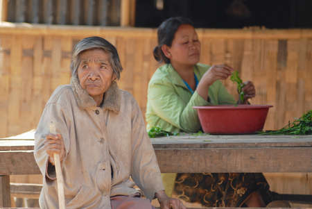 Luang Prabang, Laos, February 13, 2007 - Women in the traditional village near Luang Prabang, Laos.のeditorial素材