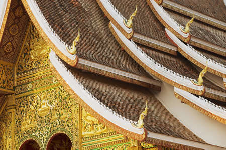 Facade and roof decoration of the Haw Pha Bang Buddhist temple at the Royal Palace Museum in Luang Prabang, Laos.のeditorial素材