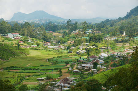 NUWARA ELIYA, SRI LANKA - MAY 22, 2011: View to the countryside buildings with beautiful landscape in Nuwara Eliya, Sri Lanka.のeditorial素材