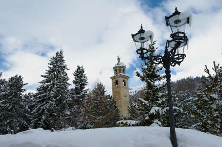 St. Moritz, Switzerland - March 06, 2009: View to the inclining bell tower at the ski resort town of...