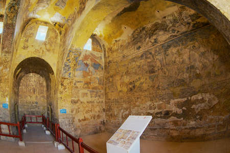Zarqa, Jordan - August 23, 2012: Interior of the ancient Umayyad desert castle of Qasr Amra with roman mural wall and ceiling decoration in Zarqa, Jordan.のeditorial素材