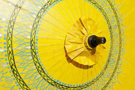 Chiang Mai, Thailand - November 10, 2008: Decoration of a traditional paper and bamboo yellow umbrella handmade in Chiang Mai, Thailand.のeditorial素材