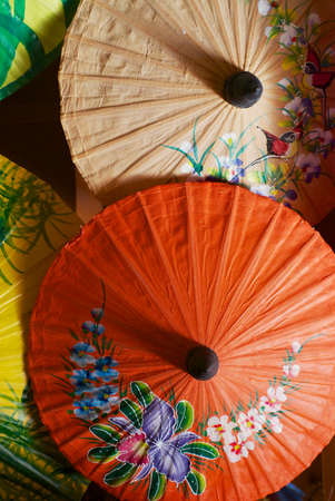 Chiang Mai, Thailand - November 10, 2008: Traditional handmade decorated paper and bamboo umbrellas on a display at a factory in Chiang Mai, Thailand.のeditorial素材