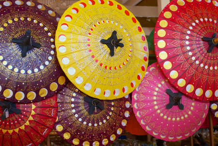Chiang Mai, Thailand - November 10, 2008: Traditional handmade decorated paper and bamboo umbrellas on a display at a factory in Chiang Mai, Thailand.のeditorial素材