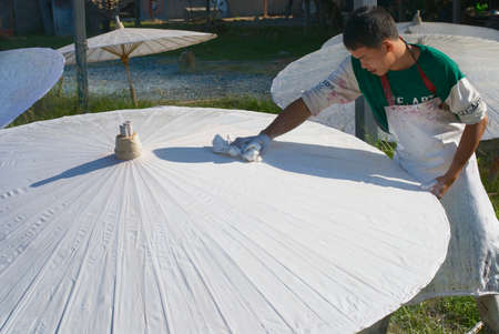 Chiang Mai, Thailand - November 11, 2008: Unidentified Thai man paints in China, Thailand.のeditorial素材