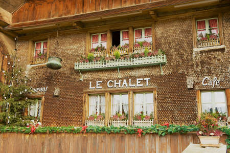 Gruyeres, Switzerland - December 11, 2009: Facade of an old traditional wooden swiss chalet building in Gruyeres, Switzerland.のeditorial素材