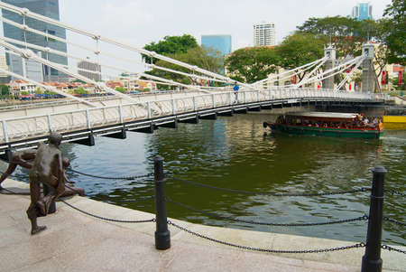 Singapore, Singapore - August 05, 2008: Historic Cavenagh Bridge over the Singapore River in Singapore.のeditorial素材