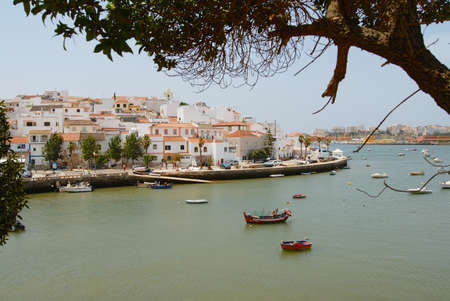 Ferragudo, Portugal - July 18, 2006: View to Ferragudo town from across the Rio Arade on July 18, 2006 in Ferragudo, Portugal.のeditorial素材