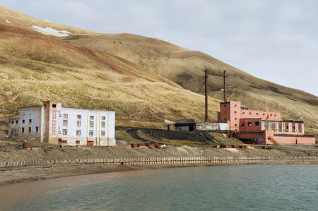 Pyramiden, Norway - September 03, 2011: Ruined buildings of the power plant station at the abandoned Russian arctic settlement Pyramiden, Norway.のeditorial素材
