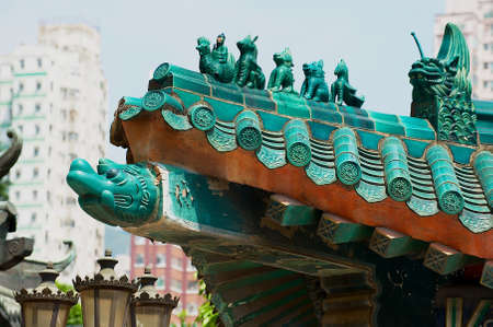 Hong Kong, China - September 14, 2012: Traditional historical roof decoration detail of the Sik Sik Yuen Wong Tai Sin temple at Kowloon in Hong Kong, China.のeditorial素材