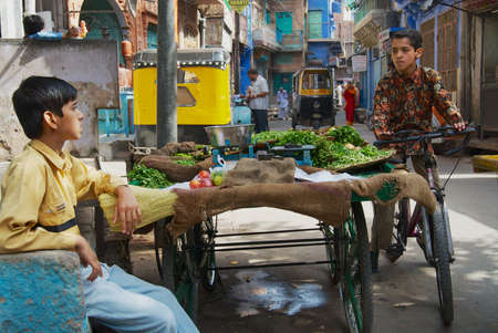 Jodhpur, India - April 06, 2007: Unidentified teenager sells fruits at the street in Jodhpur, India.