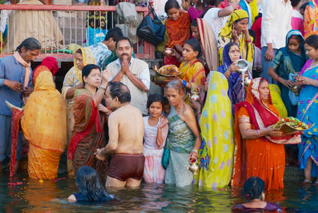 Varanasi, India - March 25, 2007: Unidentified pilgrims bathe in Holy Ganges river at sunrise in Varanasi, India.のeditorial素材