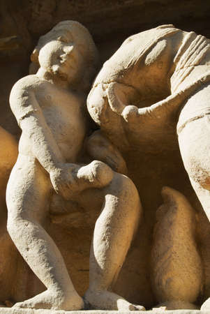 Erotic sculptures at Vishvanatha Temple at the  Western temples of Khajuraho in Madhya Pradesh, India.の写真素材
