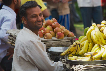 Jodhpur, India - April 06, 2007: Unidentified man sells fruits at the street market in Jodhpur, India.のeditorial素材