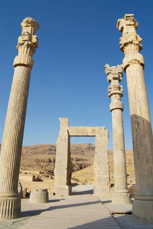 Shiraz, Iran - June 19, 2007: Ancient columns at the ruins of Persepolis in Shiraz, Iran. Persepolis...