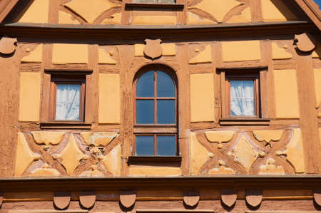 Rothenburg Ob Der Tauber, Germany - September 06, 2010: Facade detail of the historical wooden frame building in Rothenburg Ob Der Tauber, Germany.のeditorial素材