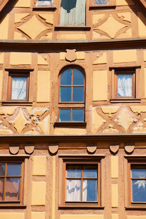Rothenburg Ob Der Tauber, Germany - September 06, 2010: Facade detail of the historical wooden frame building in Rothenburg Ob Der Tauber, Germany.のeditorial素材