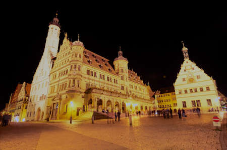 Rothenburg Ob Der Tauber, Germany - September 06, 2010: Unidentified tourists visit Market square at midnight in Rothenburg Ob Der Tauber, Germany.のeditorial素材