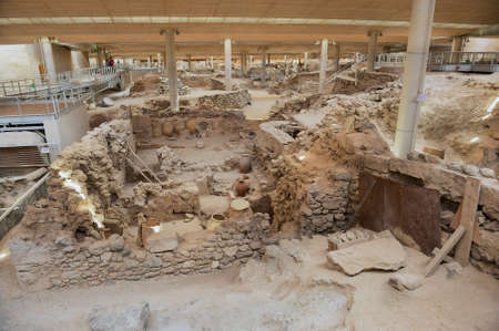 Akrotiri, Greece - August 01, 2012: Ruins of the ancient buildings and decorated pottery from the...
