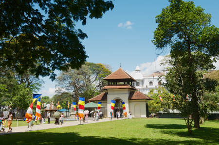 Kandy, Sri Lanka - May 21, 2011: People pass entrance gate to the Temple of the Tooth (Sri Dalada Maligawa) in Kandy, Sri Lanka.のeditorial素材