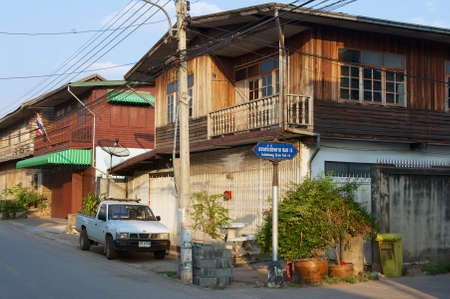 Chiang Khan, Thailand - April 17, 2010: View to the street with traditional residential buildings in Chiang Khan, Thailand.のeditorial素材