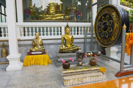 Bangkok, Thailand - April 20, 2010: Buddha statues and drum in Wat Saket Ratcha Wora Maha Wihan (the Golden Mount temple) in Bangkok, Thailand.のeditorial素材