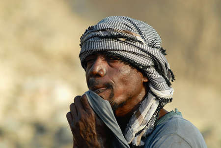 Aden, Yemen - September 14, 2006: Portrait of unidentified man wearing traditional head scarf in Aden, Yemen.のeditorial素材